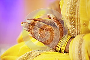 Hindu Bride crossing hands for prayer on her  wedding eve photo