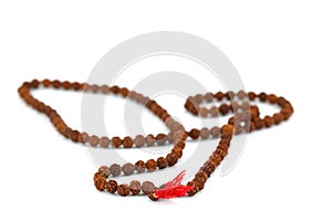 Hindu and buddhist prayer beads garland on white