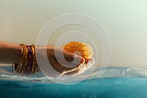 Hindu Ceremonies, Rituals, Spirituality, Religion and Hope Concept. Woman Holdings Marigold Flowers in Water , Respect and