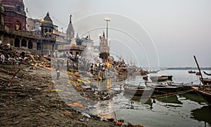 Hindu cremation ceremony at Manikarnika Ghat on banks of holy Ganges river. Varanasi Uttar Pradesh India