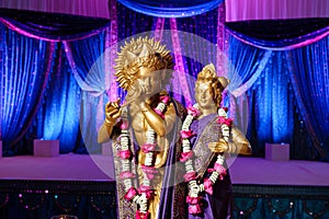 Hindu Deities in front of mandap at Indian wedding