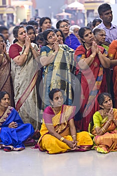 Hindu devotees gather and pray