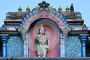 Hindu divinity sculptures on the roof of temple in Batu Caves campus