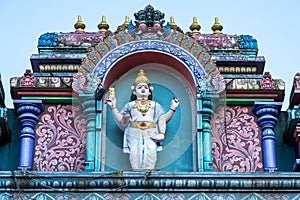 Hindu divinity sculptures on the roof of temple in Batu Caves campus