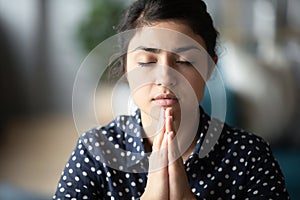 Hindu girl student folding hands, praying god for good luck.