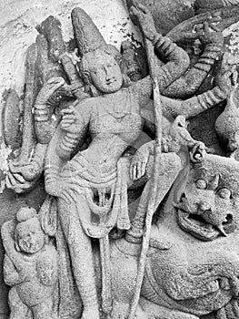 Hindu God deity statue. Ancient sandstone carved historical Hindu God sculptures in the temple walls.