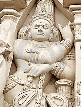 Hindu God deity statue. Ancient sandstone carved historical Hindu God sculptures in the temple walls.