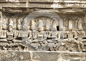 Hindu God deity statue. Ancient sandstone carved historical Hindu God sculptures in the temple walls.