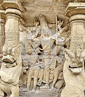 Hindu God deity statue. Ancient sandstone carved historical Hindu God sculptures in the temple walls.