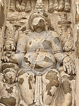 Hindu God deity statue. Ancient sandstone carved historical Hindu God sculptures in the temple walls.