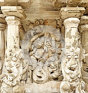 Hindu God deity statue. Ancient sandstone carved historical Hindu God sculptures in the temple walls.