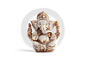 Hindu god Ganesh on a black background. Statue with incense smoke aromo sticks