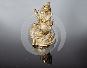 Hindu God Ganesh (Ganesha) Statuette, isolated on a black background