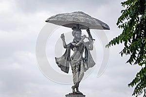 hindu god lord krishna isolated statue with bright background at morning from flat angle