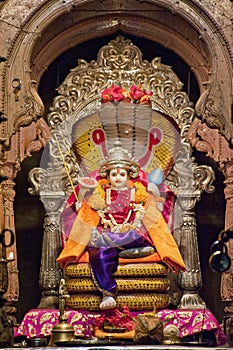 Hindu God Vishnu siting on a snake (Shesha)at Shri Ram Temple complex at Phaltan photo