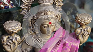 Hindu goddess lakshmi devi statue .hinduism goddesses Sarasvati, Lakshmi and Durga. Closeup of face of Goddess Durga