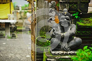 Hindu idol of the deity stone statue sitting at the entrance of the house.