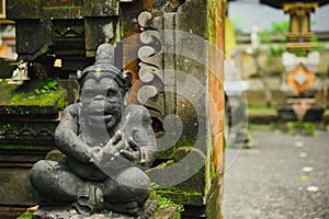 Hindu idol of the deity stone statue sitting at the entrance of the house.