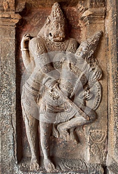 Hindu Lord Narasimha killing the evil. Indian rock-cut architecture of the 7th century temple, in town Pattadakal, India
