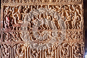 Hindu lord Shiva and his wife Parvati, servants on a column with patterns in 7th century temples in Pattadakal, India.