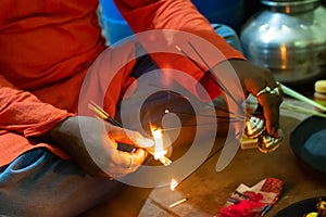 Hindu man doing pooja  arti in the temple or home. Celebreting Indian festival at home concept photo