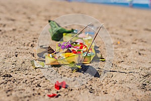 Hindu offerings and gifts to god on the beach in Bali, Indonesia