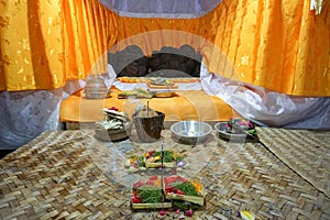 Hindu Offerings at a Temple in Bali, Indonesia. Elaborate handmade offerings are brought to the temple