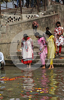 Hindu people bathing in the ghat near the Dakshineswar Kali Temple in Kolkata