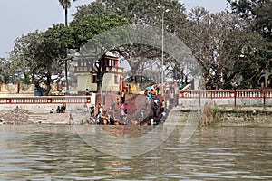 Hindu people bathing in the ghat near the Dakshineswar Kali Temple in Kolkata
