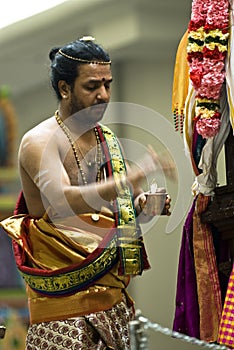 Hindu priest performs the pooja
