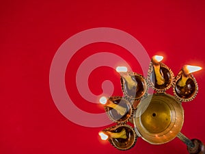 Hindu puja essential panch pradeep or five headed oil lamp burning with glowing flame. these are used in durga , saraswati , kali