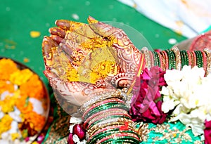 Hindu Rituals haldi on bride`s hands phere