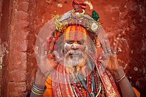 Hindu Saint happily posing for a photo