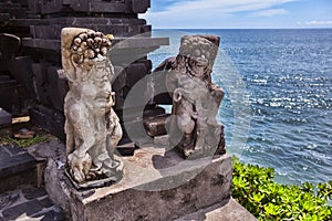 Hindu statue near enter to a sacred place. Bali island.