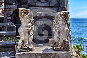 Hindu statue near enter to a sacred place. Bali island.