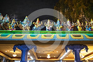 Hindu statues on top the Catu Cave temple.