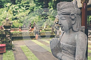 Hindu stone statue in the balinese temple. Tropical island of Bali, Indonesia.