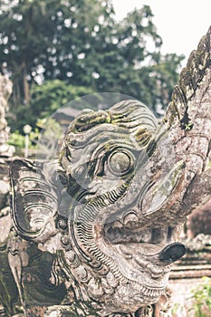 Hindu stone statue in the balinese temple. Tropical island of Bali, Indonesia.