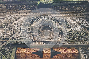 Hindu stone statue in the balinese temple. Tropical island of Bali, Indonesia.