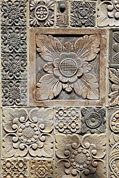 Hindu style carvings and ornaments,detail from stone wall in Bali,Indonesia