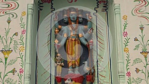 Hinduism gods statue on temple wall in Varanasi