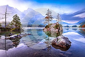 Hintersee Lake, Germany. Beautiful autumn sunrise scene with trees of Hintersee Lake, Berchtesgaden