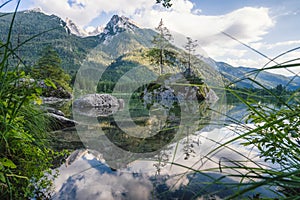 Hintersee Lake with reflection of Watzmann mountain peaks. Ramsau Berchtesgaden Bavaria, Germany, Europe