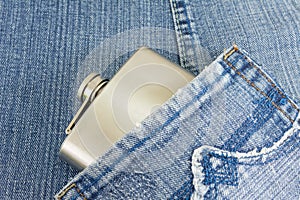 Hip flask in denim jeans pocket