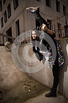 Hip-hop dancer girl posing on the deserted streets