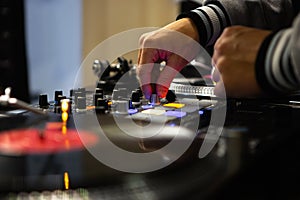 Hip hop dj mixing music with professional audio mixing controller device