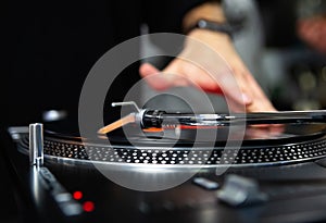 Hip hop dj scratches record on turn table device
