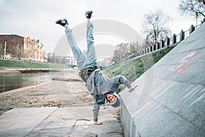 Hip hop performer, upside down motion on street