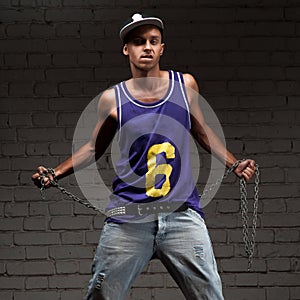 Hip-hop style man holding chain