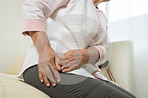 Hip pain of senior woman at home, healthcare problem of senior concept